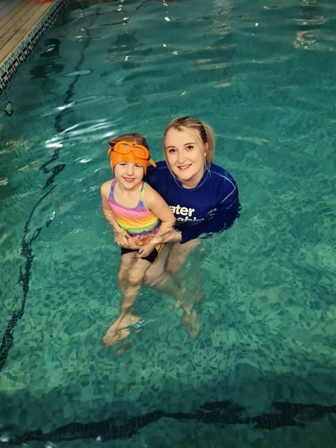 holly and his daughter in a water babies lesson