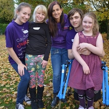 Trudi beswick with children and volunteers